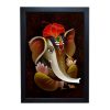 An ornate Ganeshji frame with intricate detailing and vibrant colors.