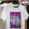A family of four wearing colorful Holi t-shirts, smiling and ready to celebrate.
