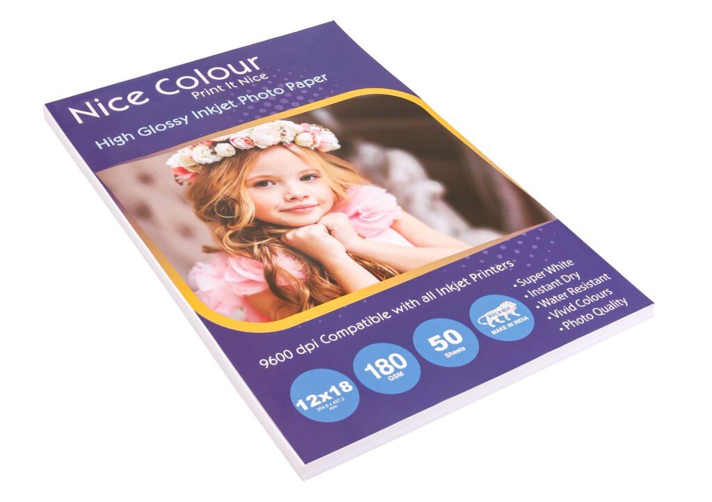 A stack of "High Glossy Inkjet Photo Paper 12x18in 180 GSM 50 Sheets" showing its highly reflective surface, next to an inkjet printer, with a large, vibrant printed photograph showcasing excellent color reproduction and sharp detail.
