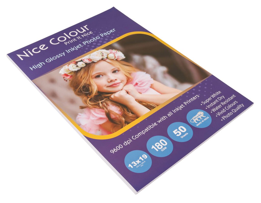A stack of "High Glossy Inkjet Photo Paper 13x19 Inch 180GSM 50 Sheet" highlighting its smooth, reflective surface, next to an inkjet printer, with a printed 13x19 inch photograph showcasing vibrant colors and impressive detail.