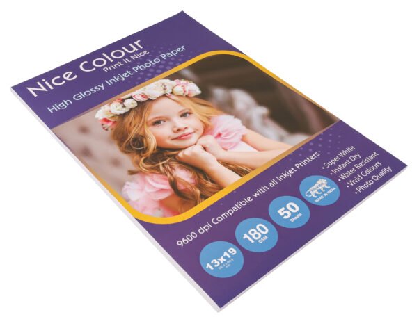 A stack of "High Glossy Inkjet Photo Paper 13x19 Inch 180GSM 50 Sheet" highlighting its smooth, reflective surface, next to an inkjet printer, with a printed 13x19 inch photograph showcasing vibrant colors and impressive detail.