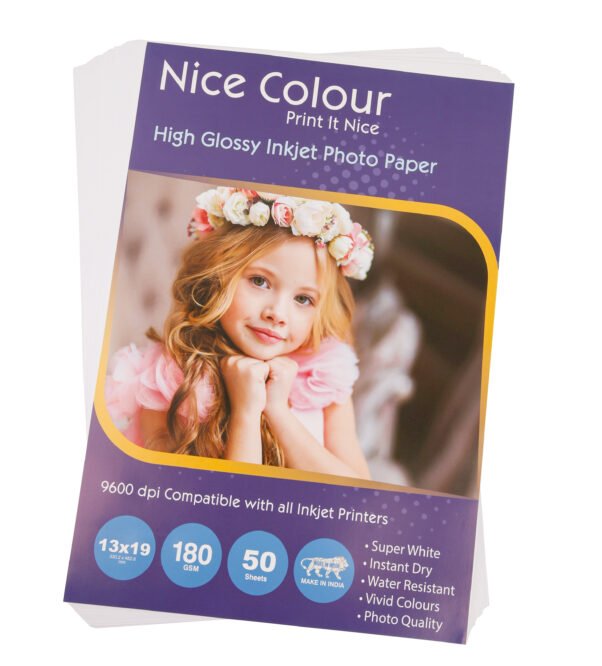 A stack of "High Glossy Inkjet Photo Paper 13x19 Inch 180GSM 50 Sheet" highlighting its smooth, reflective surface, next to an inkjet printer, with a printed 13x19 inch photograph showcasing vibrant colors and impressive detail.