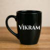 A personalized mug for a male boss featuring a custom design and his name, filled with coffee on a professional desk.