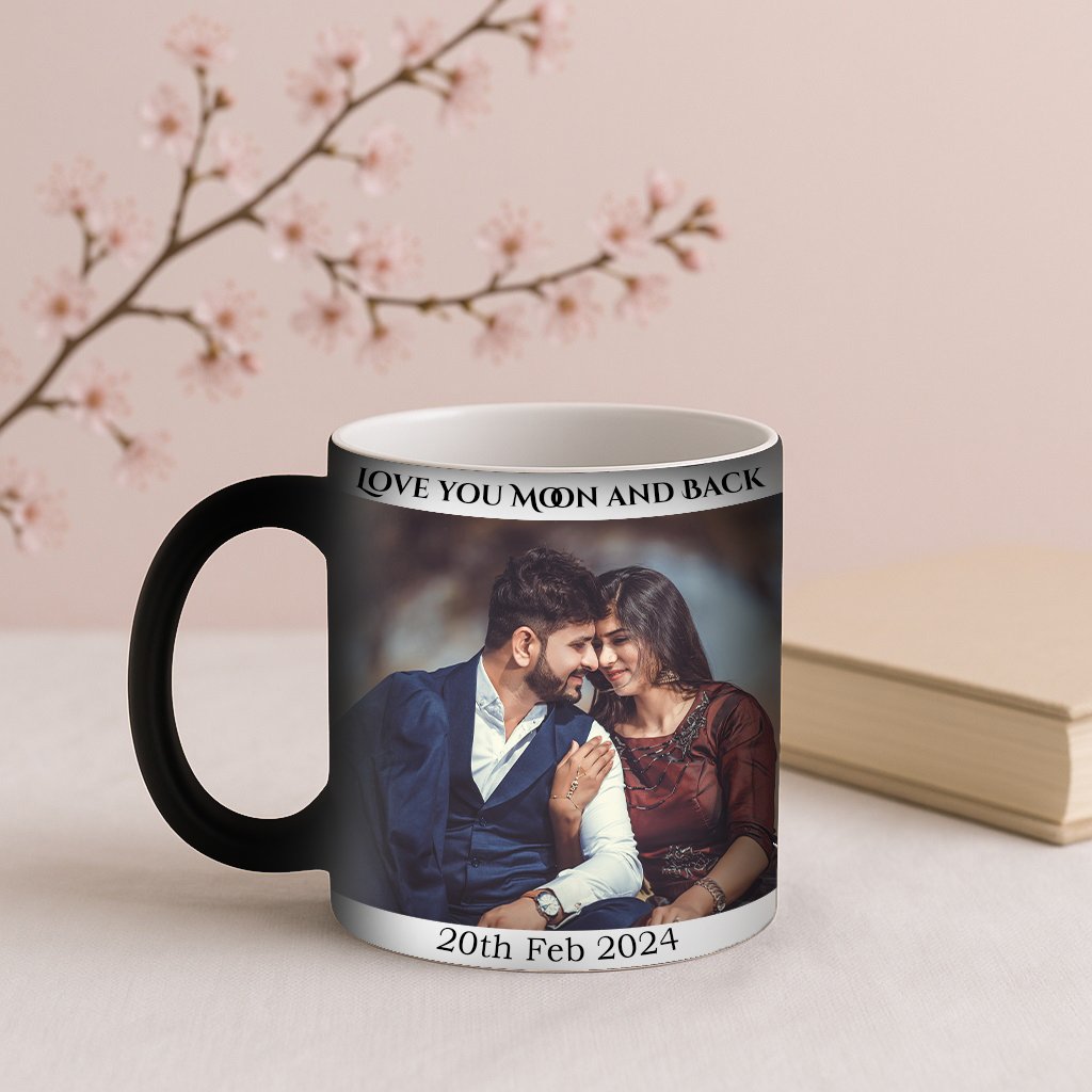 A Couple Magic Mug, initially black, with steam rising from it as a hot beverage is poured in, slowly revealing a hidden, cherished photo of a smiling couple embracing, with a subtle "I Love You" message appearing underneath.