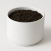 A personalized ceramic planter pot, 10 cm diameter, 7 cm height, featuring a custom design and a small succulent plant.