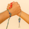 A "Peacock Design Bhaiya Bhabhi Rakhi Set" featuring intricate metallic peacock charms with vibrant blue and green enamel work