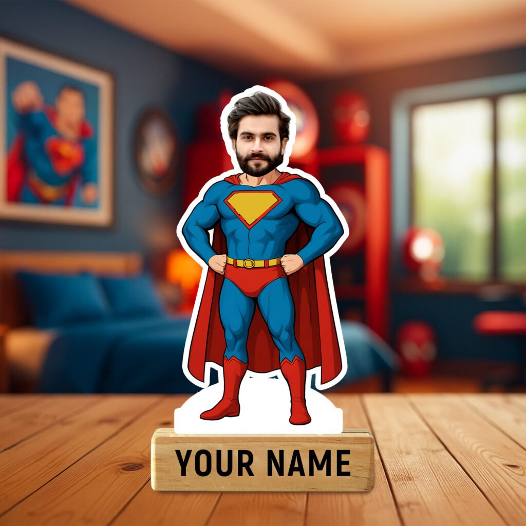 A "Personalized Superman Caricature Standee" featuring a custom face on a classic Superman body in a blue suit and red cape, mounted on a wooden base with "SUPERMAN" inscribed, set against a bedroom backdrop.