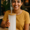 A white Spotify Code Tumbler with a bamboo lid and clear straw, featuring a custom photo of a couple, song title "Tum Hi Ho," artist "Arijit Singh," Spotify player controls, and the song title repeated at the bottom, mimicking the Spotify interface.