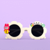 A pair of white, flower-shaped "Kids Sunglasses with Name" featuring a red bunny character on one side and the personalized name