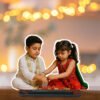 A "Rakhi Caricature for Brother and Sister" depicting a personalized standee of a young boy and girl in traditional attire, with a Rakhi thali between them, celebrating Raksha Bandhan, set against a bokeh background.
