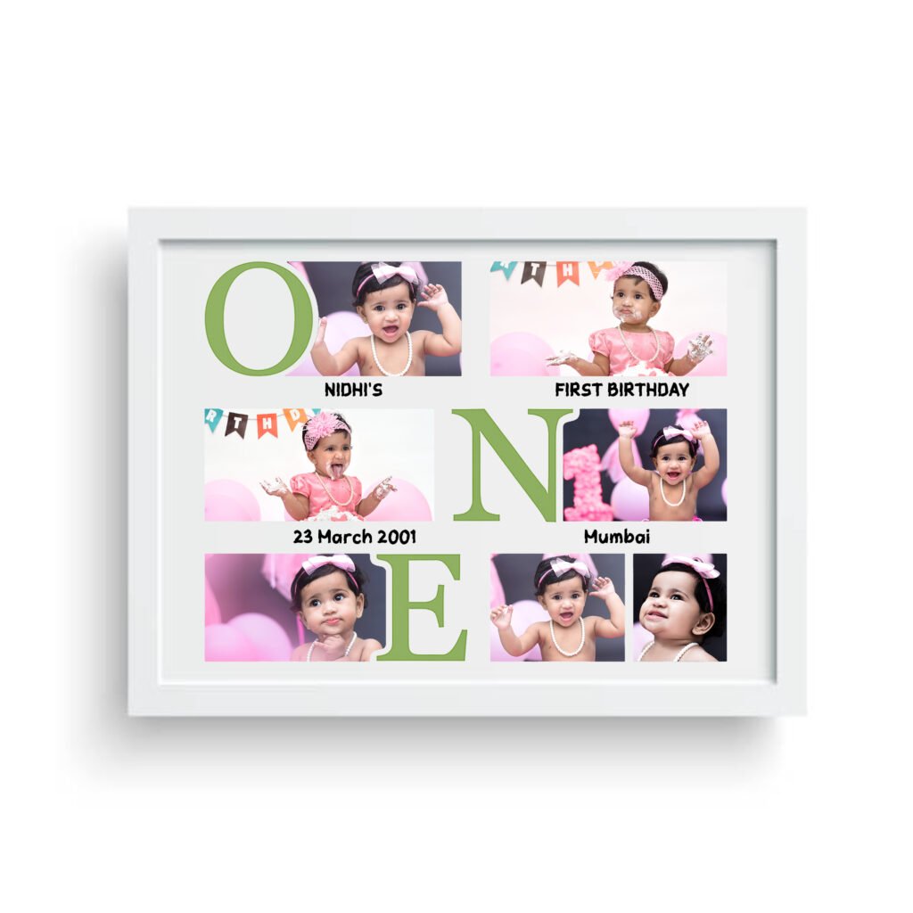 A white framed Personalized Baby First Year Photo Frame featuring the word "ONE" spelled out with large letters integrated with small photos of a baby (Nidhi), along with text indicating "NIDHI'S FIRST BIRTHDAY," "23 March 2001," and "Mumbai."