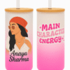 A white and pink gradient Personalized Tumbler for Girls with a bamboo lid and clear straw. One side features an illustration of a stylish girl with a red bandana and sunglasses, and the name "Anaya Sharma." The other side has "MAIN CHARACTER ENERGY" text with star accents.