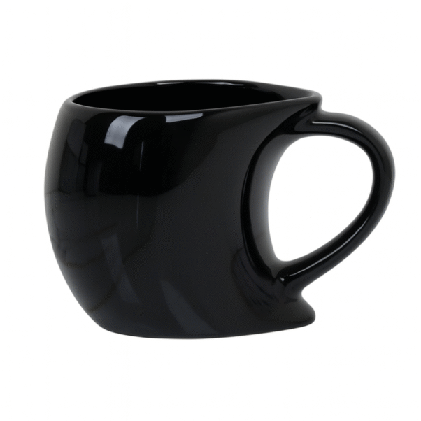 Black singapore mug with a custom 'CafeWorld' logo in orange and white, placed on a wooden desk next to a laptop and a notebook.