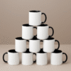 Personalized Black and White Coffee Mug with Name or Logo interior and handle on a wooden table, next to an open book and a small flower.