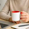 Personalized Red and White Coffee Mug with Name or Logo and a vibrant red interior and handle. The mug is shown in a dynamic setting, highlighting its bold, eye-catching style.