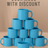 Personalized Blue Coffee Mug with Name "Your Logo Here" printed on the side, sitting on an office desk next to a laptop.